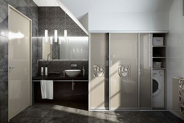 W mieszkaniach w bloku pralkę zwykle umieszcza się w łazience, ale można ją schować za estetycznymi drzwiami przesuwnymi.