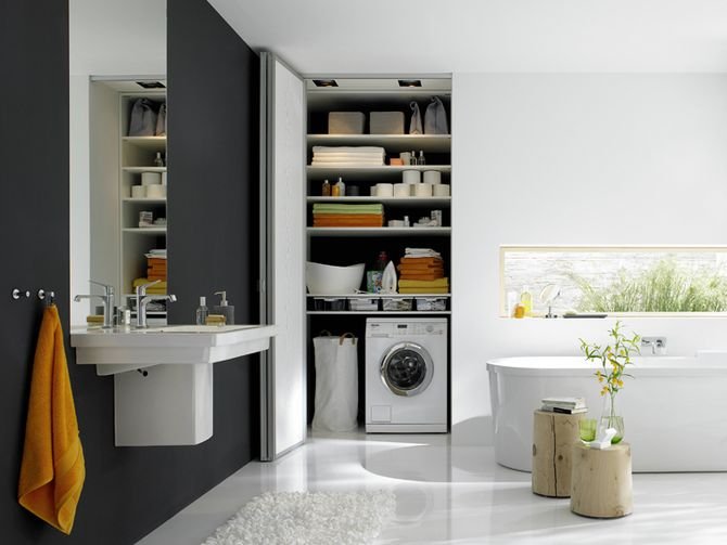 W łazienkowej szafie można umieścić nie tylko półki na reczniki i akcesoria, ale także pralkę