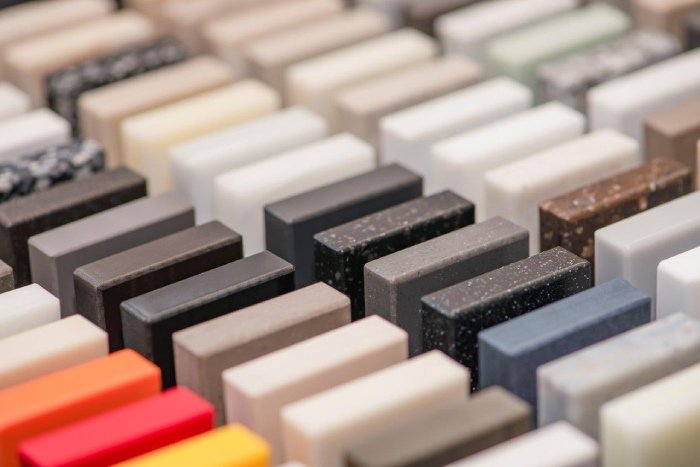 1 large selection of stone samples for countertops and floors pieces of artificial acrylic stone in a sample box a set of shades of countertops of different textures